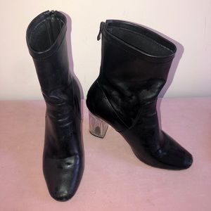 Black heeled booties with clear heel